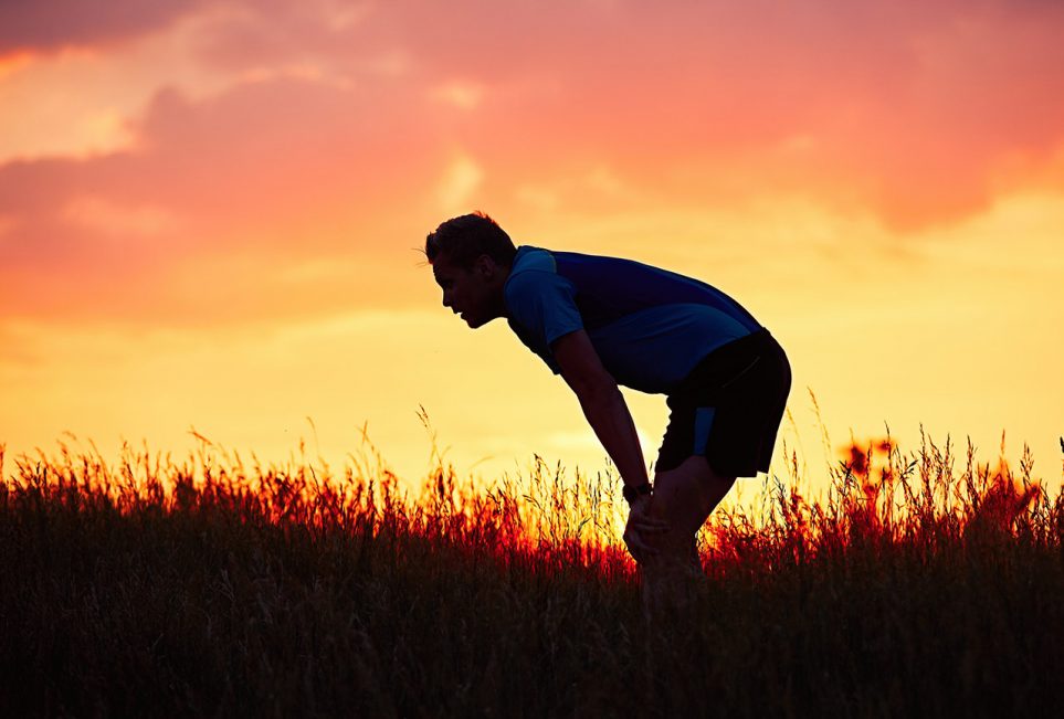 Man exhausted after intense cardiovascular exercise
